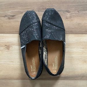 LIKE NEW black glitter Toms slip on shoes